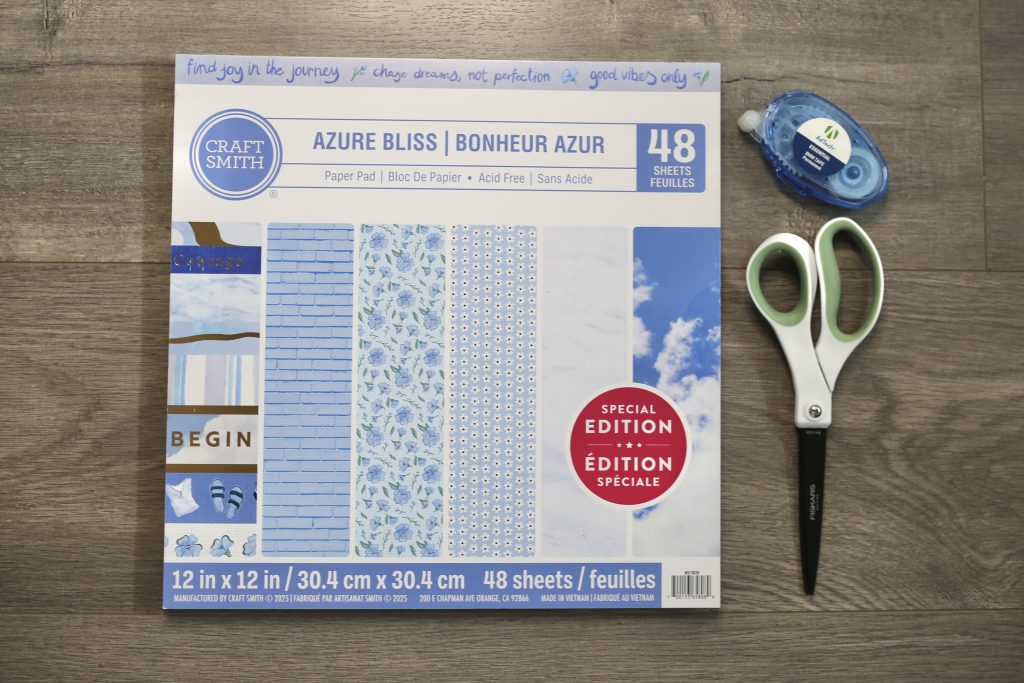 scrapbook paper with scissors and double-sided tape runner