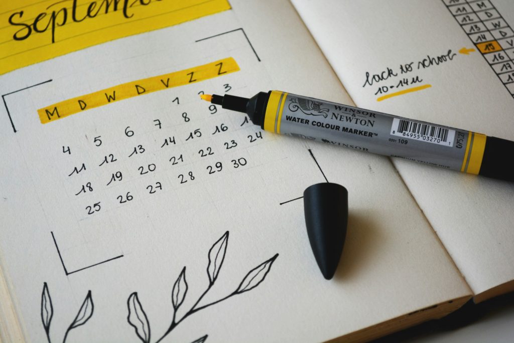calendar drawn in journal with yellow marker