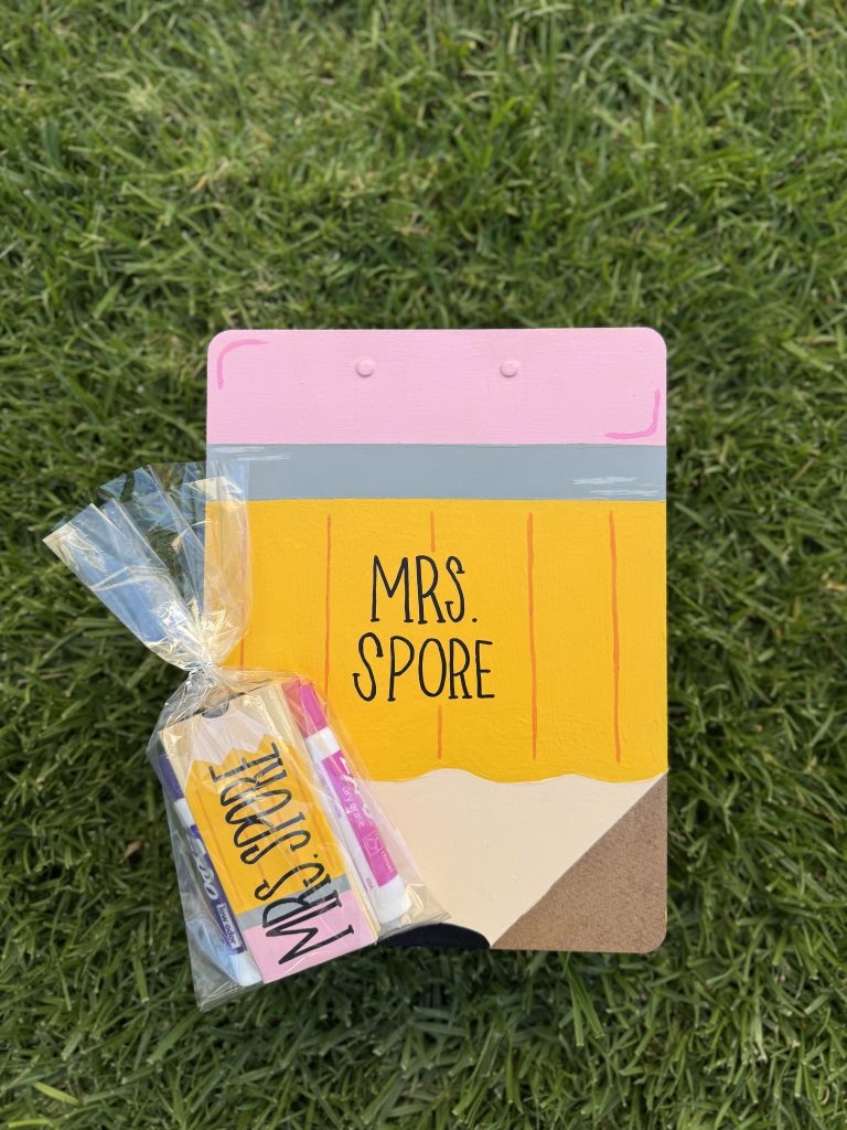 diy painted whiteboard eraser with whiteboard markers in cellophane bag and painted clipboard
