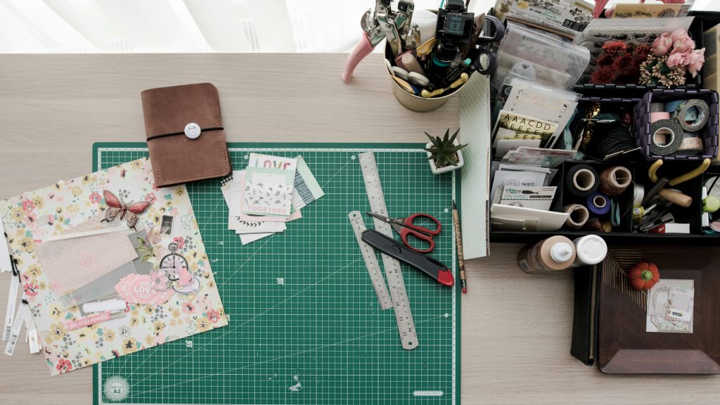 green cutting mat with craft supplies