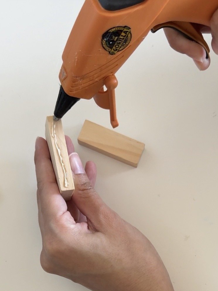 gluing mini jenga block with hot glue