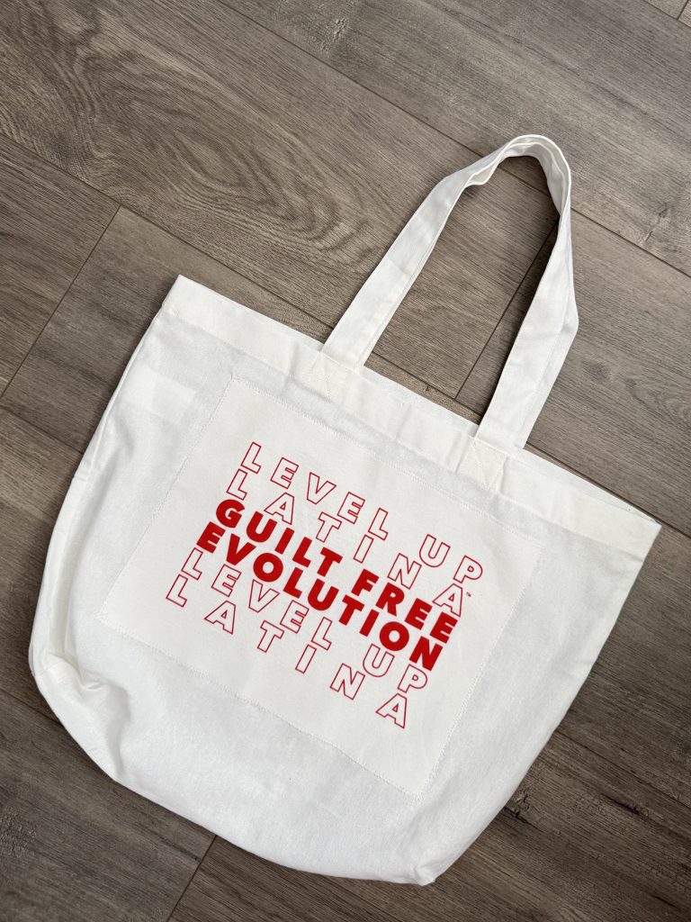 upcycled white Level Up Latina tote bag on wooden surface