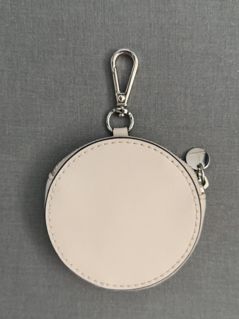 beige round coin purse