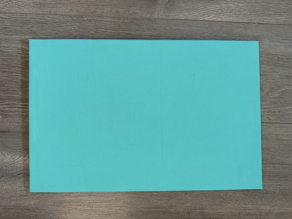 teal fabric covered cork board