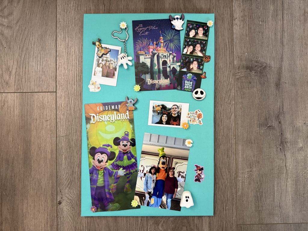 teal fabric covered cork board with photos