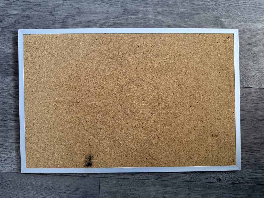 old bulletin board with marks 